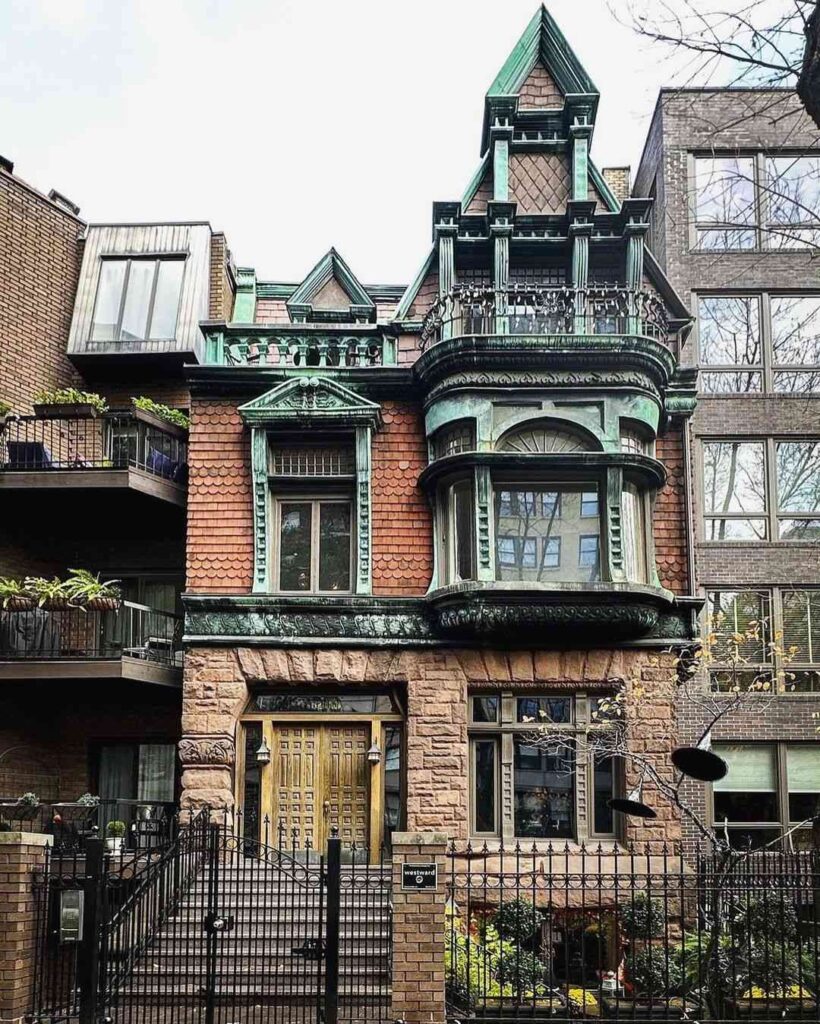 "Urban Victorian townhouse with copper-green trim and terracotta walls"