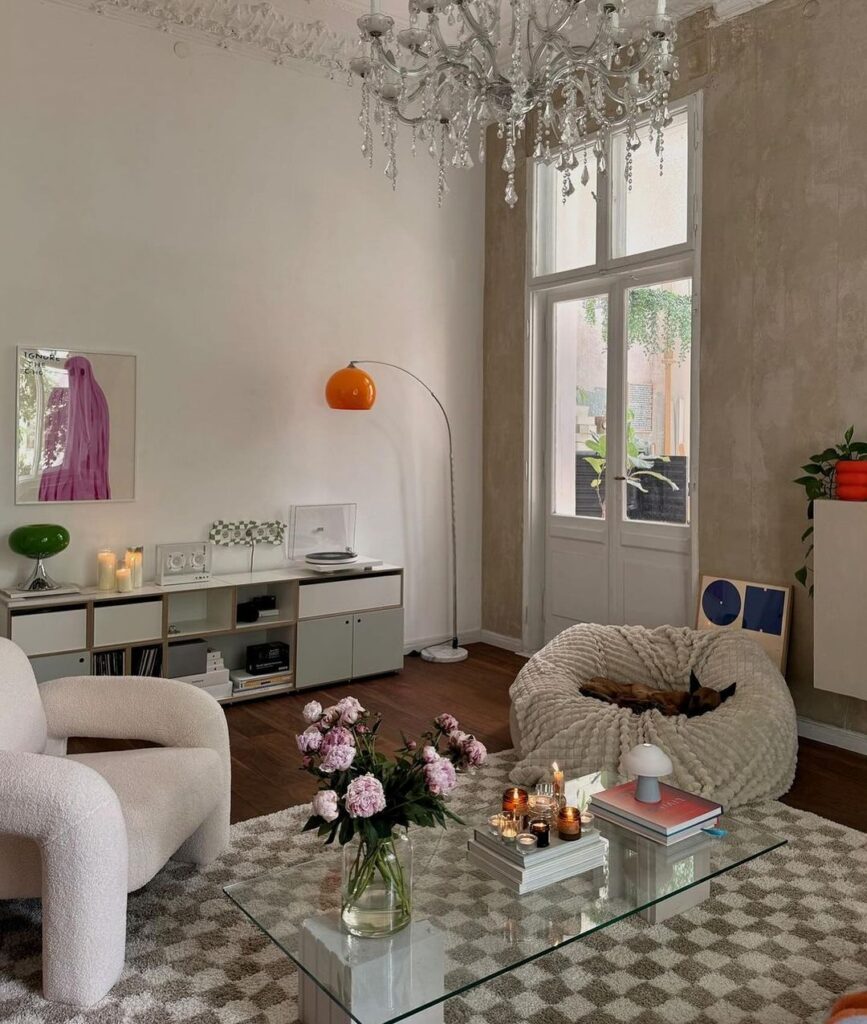 Minimalist living room with eclectic decor and natural light.