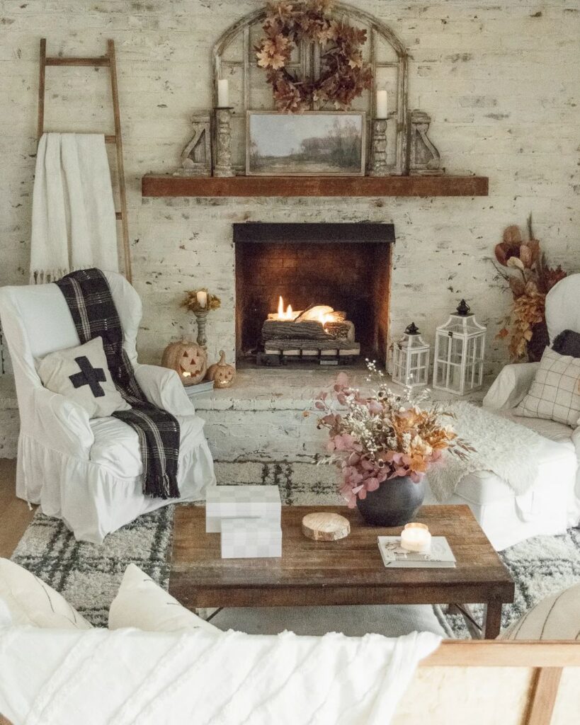 Rustic living room with fireplace and subtle Halloween decor