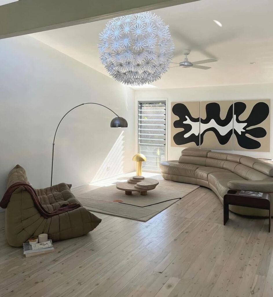 Modern living room with unique dandelion light fixture.