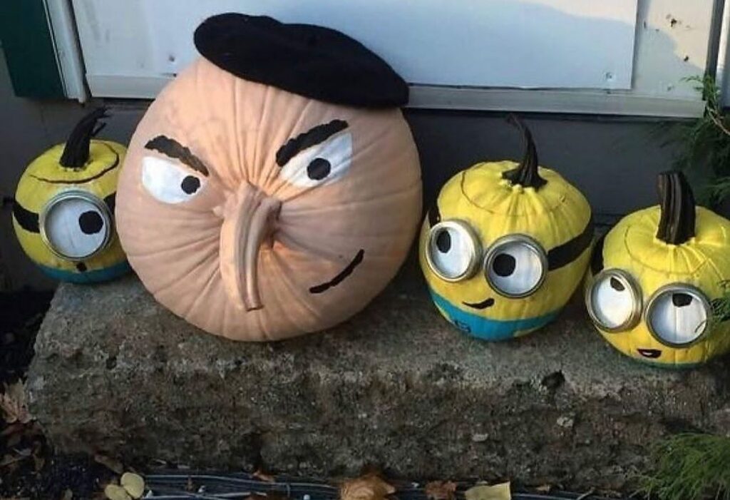Pumpkins painted as Gru and Minions from Despicable Me movie.