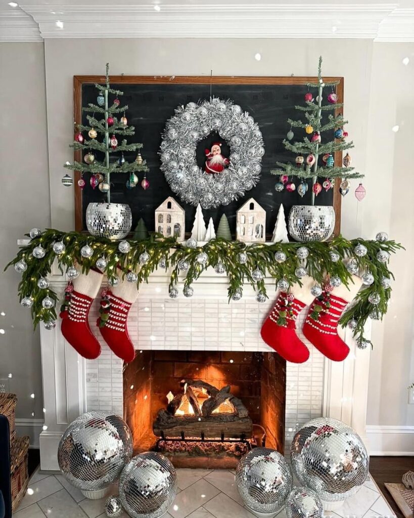 Modern Christmas mantel with disco balls silver wreath and red stockings