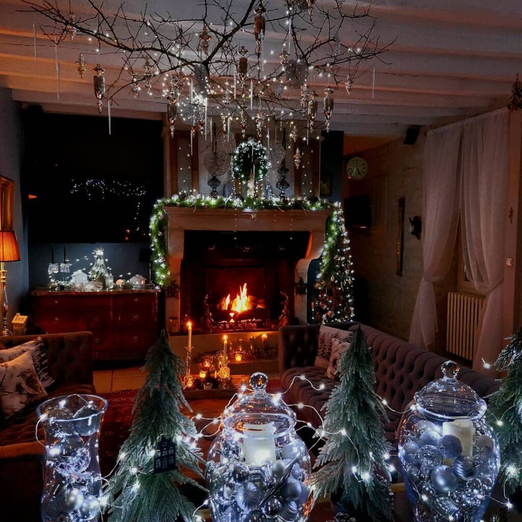 Magical Christmas fireplace with hanging crystals and illuminated glass decorations