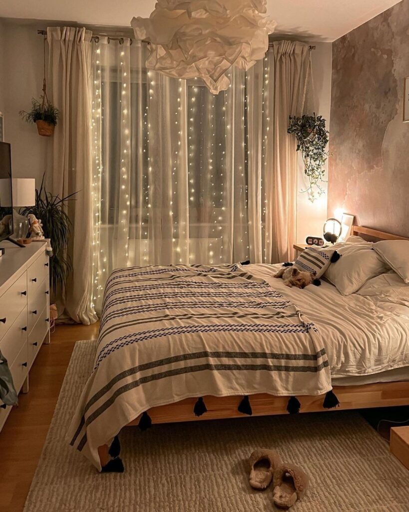 Cozy bedroom with fairy lights and hanging plants