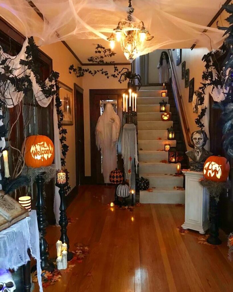 Spooky Halloween-decorated hallway with ghosts and pumpkins