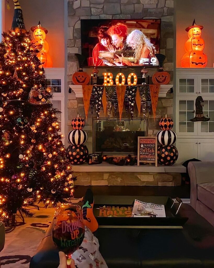 Halloween-decorated living room with Hocus Pocus on TV and festive decor