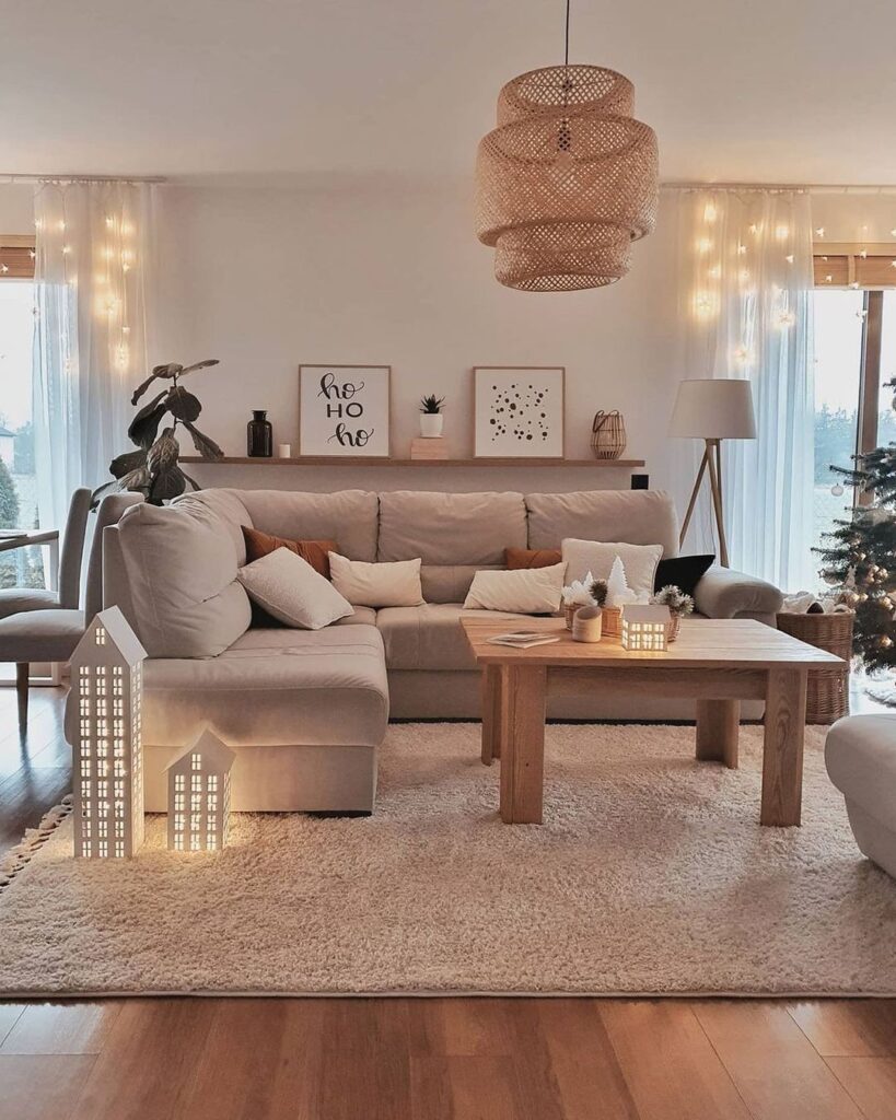 Cozy living room with sectional sofa, woven light fixture, and holiday decorations.