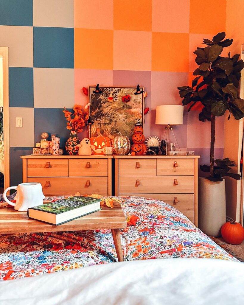 Colorful bedroom with Halloween decorations and patterned wall