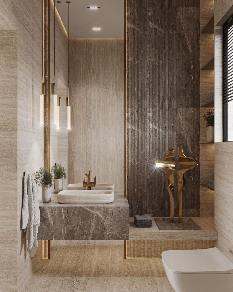 Luxurious bathroom with mixed marble finishes and gold accents.