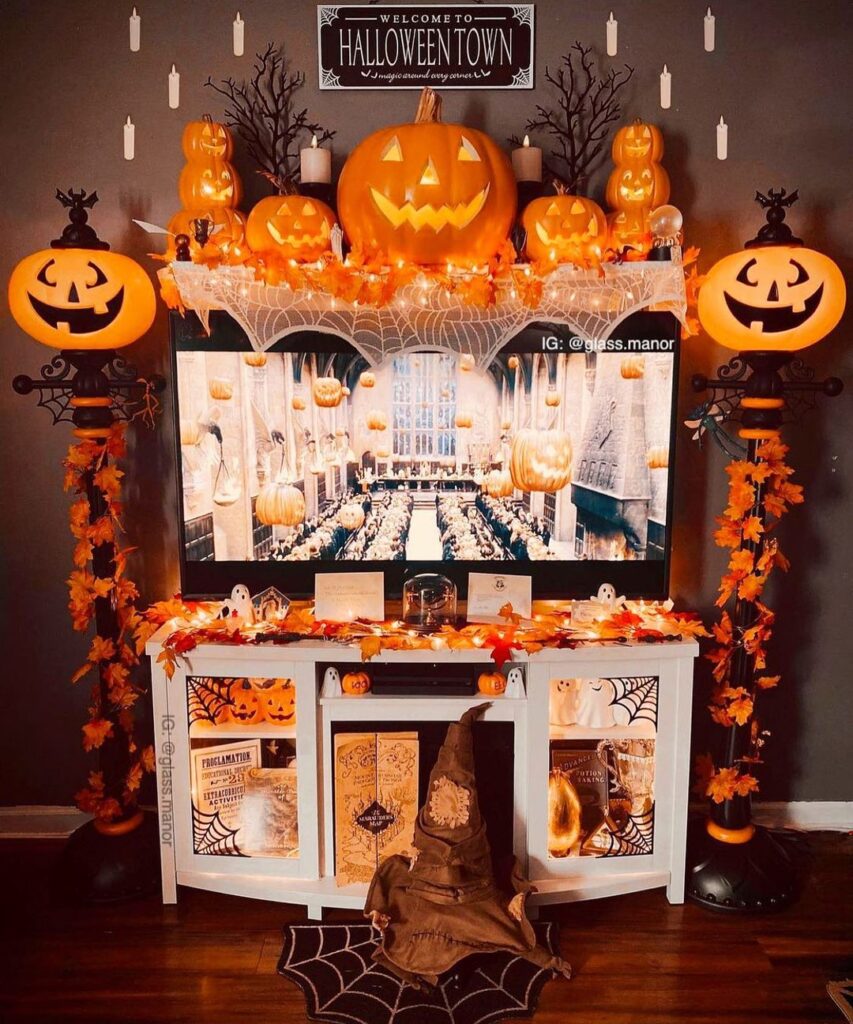 Halloween-decorated TV area with pumpkins and magical theme