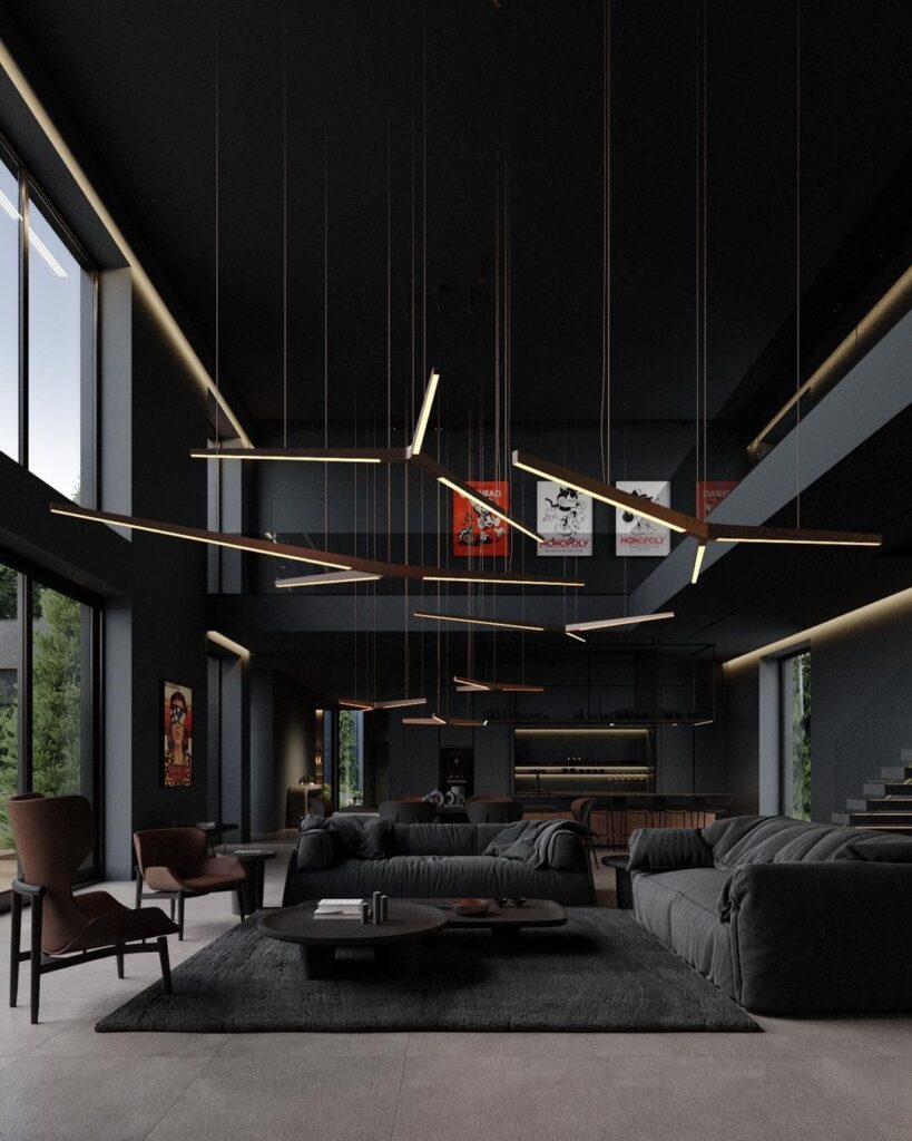 Dark living room with suspended light rods and large windows.