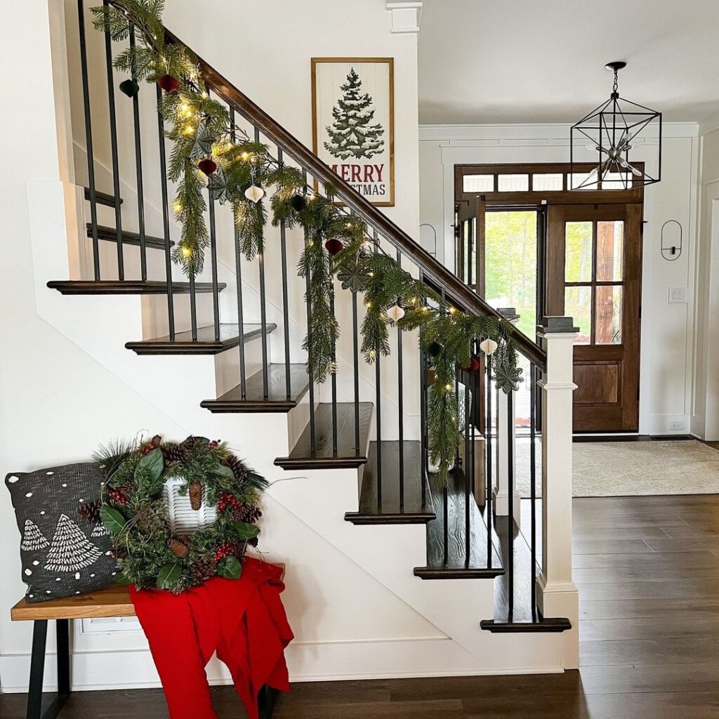 "Elegant stairway garland with modern farmhouse Christmas decor"