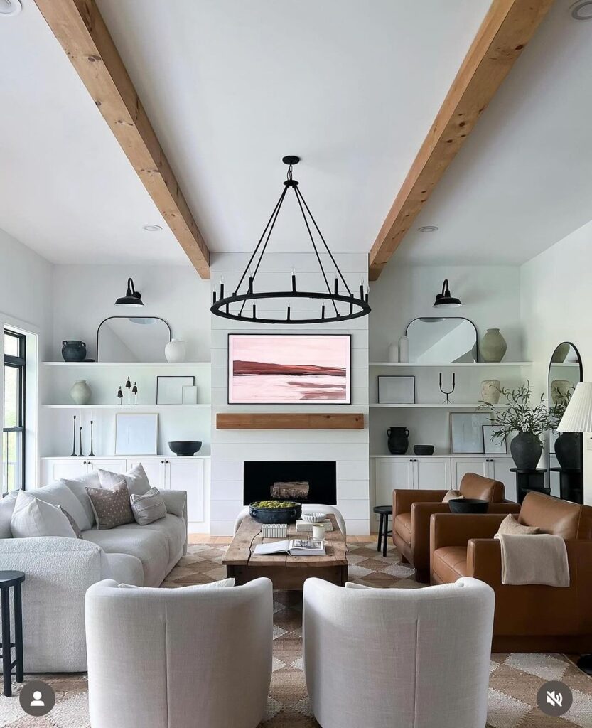 Bright living room with built-in shelves fireplace and mixed seating