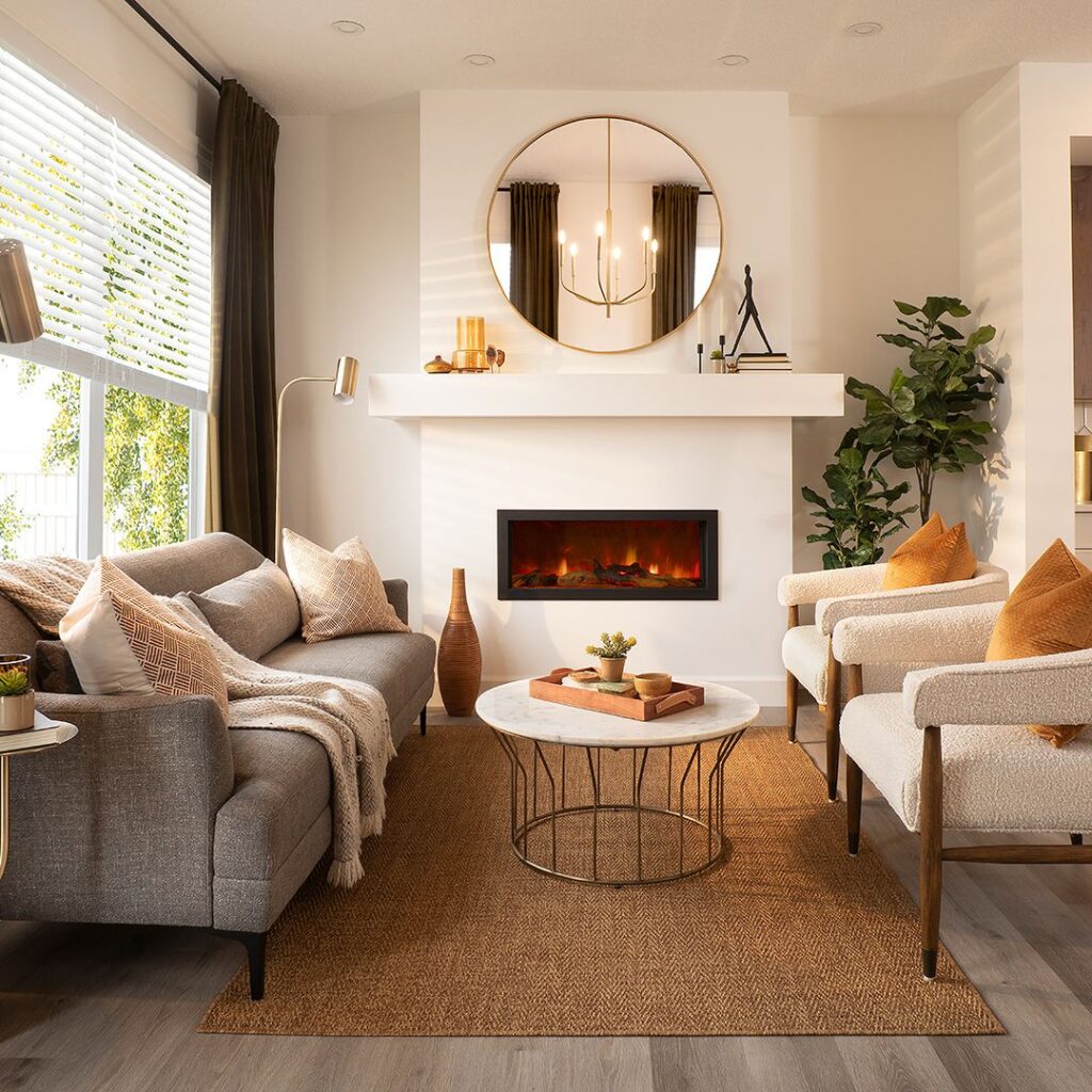 Modern living room with electric fireplace round mirror and neutral decor.