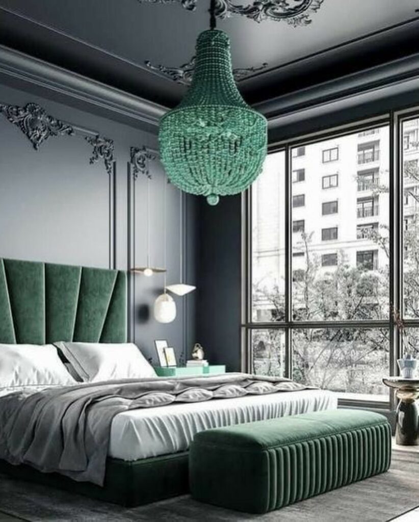 "Art deco bedroom with emerald chandelier, velvet headboard"