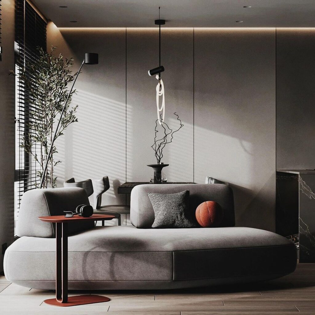 Cozy gray living room with curved sofa and artistic lighting