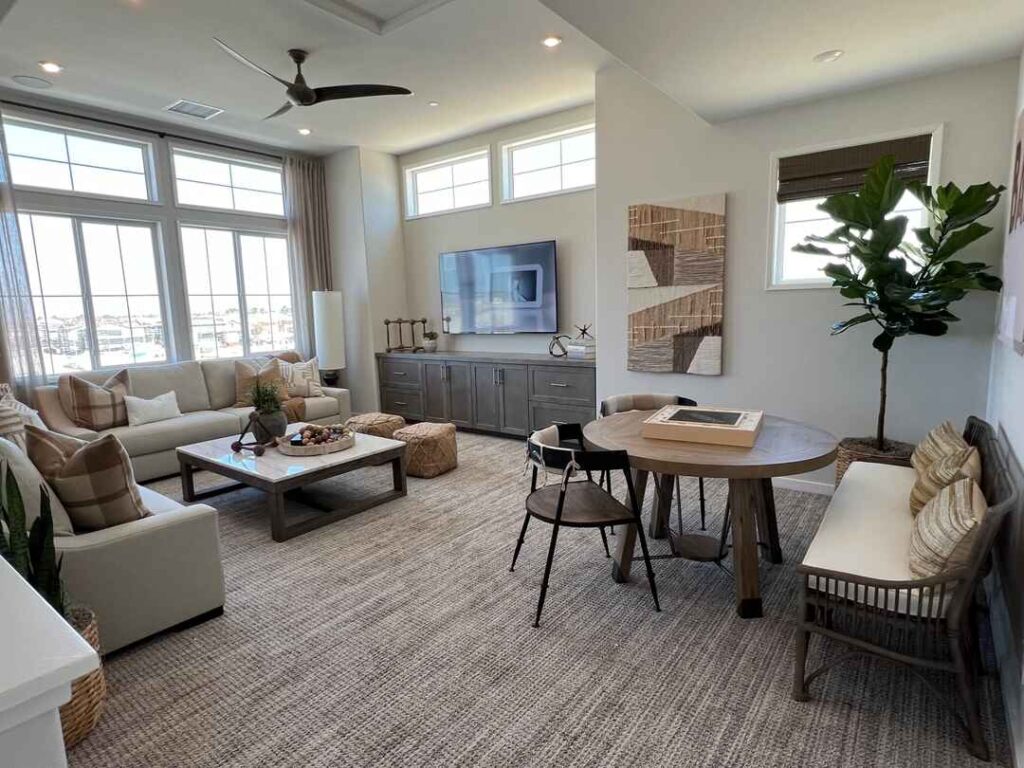 Bright, open-plan living room with integrated dining area and modern decor.