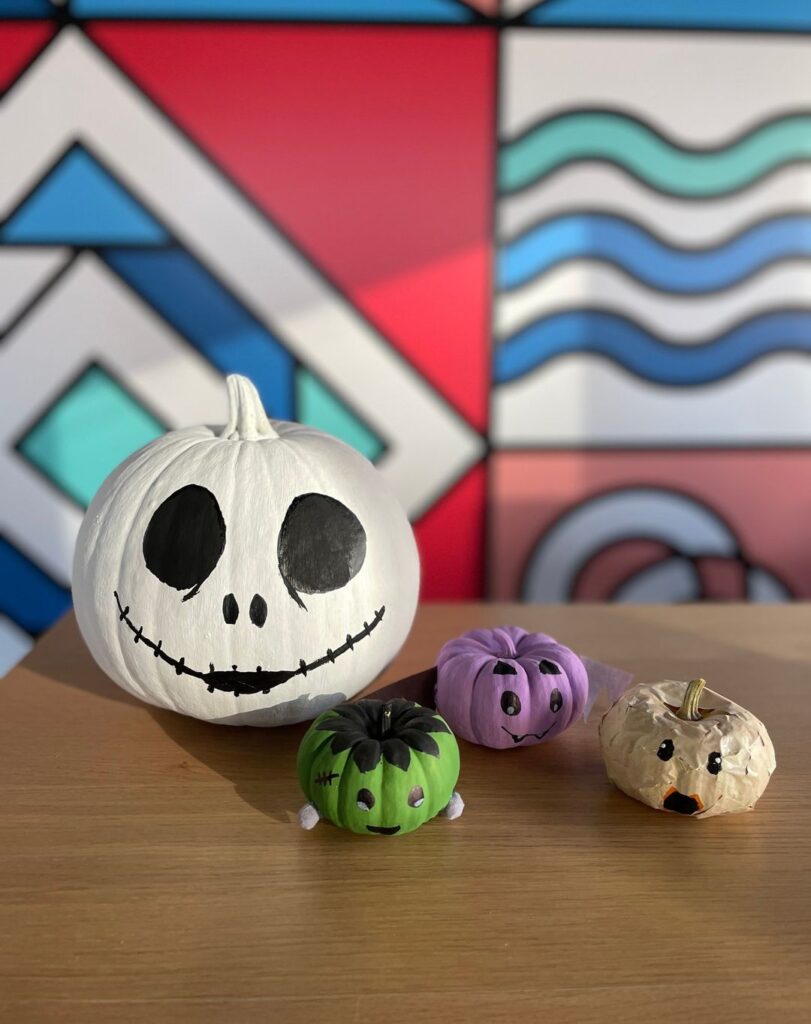 Jack Skellington pumpkin with small character pumpkins.