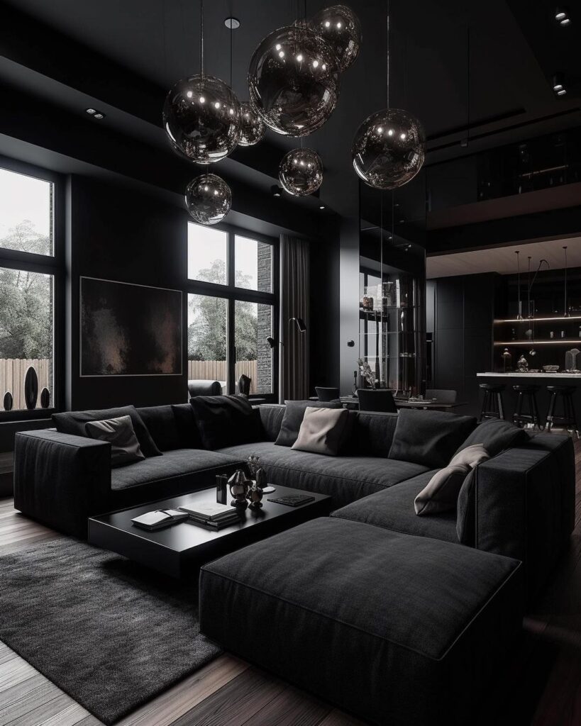 Black living room with large sofa and floating glass orb lights