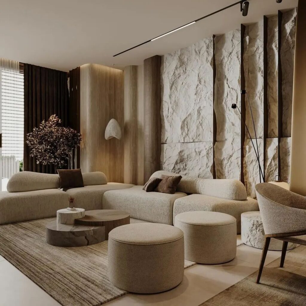 Modern living room with stone wall curvy furniture and earth tones