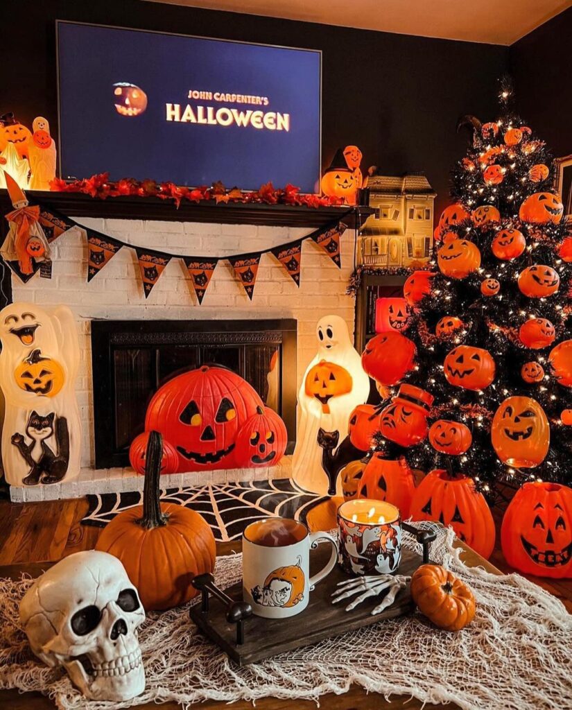 Halloween-themed room with pumpkin tree and movie setup