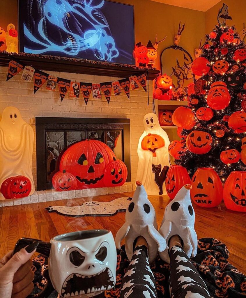 Halloween-decorated living room with pumpkin tree and ghost figures