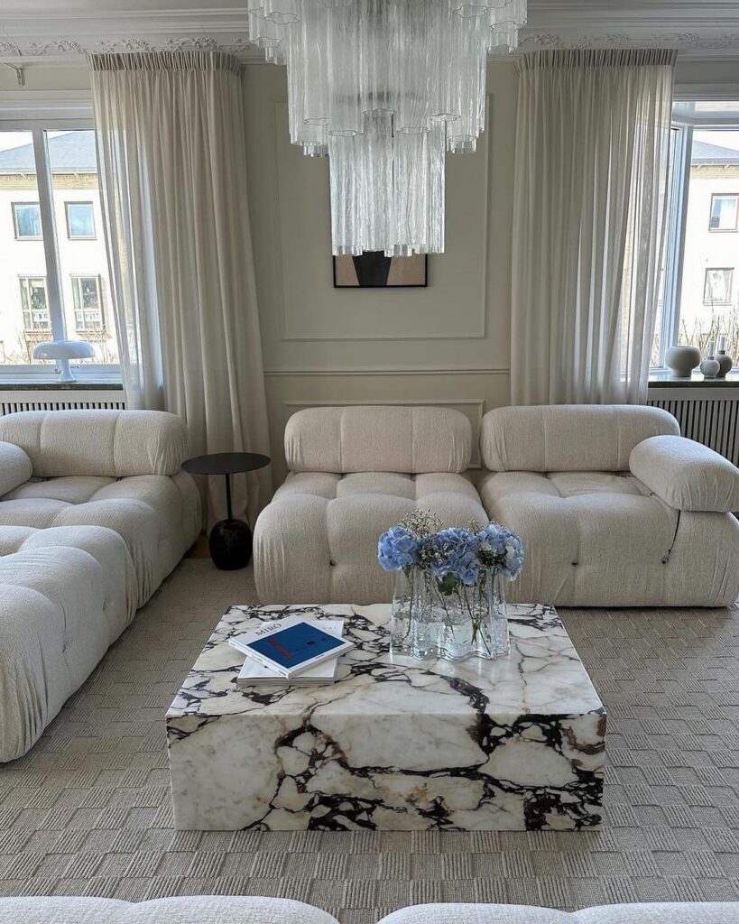 Serene minimalist living room with marble accents.