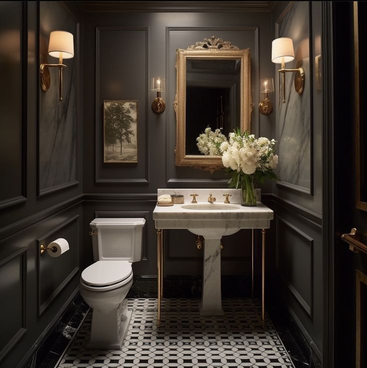 Dark elegant bathroom with gold accents and marble sink