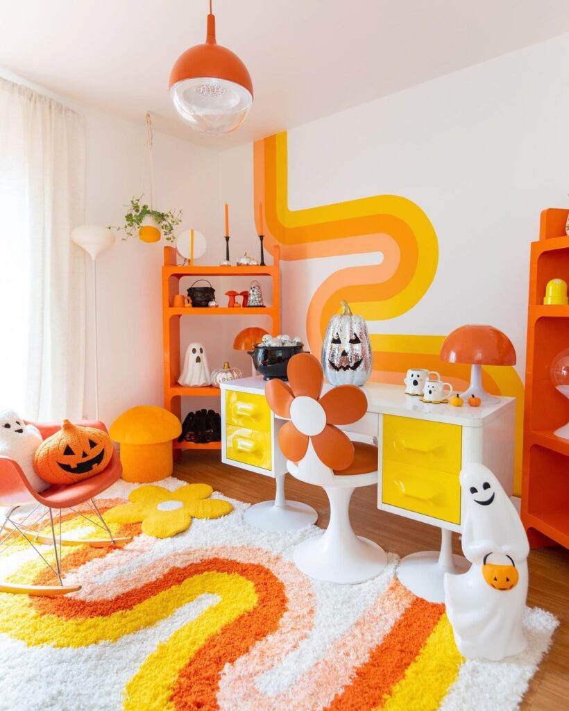 Retro-style orange and yellow livingroom with Halloween decorations.