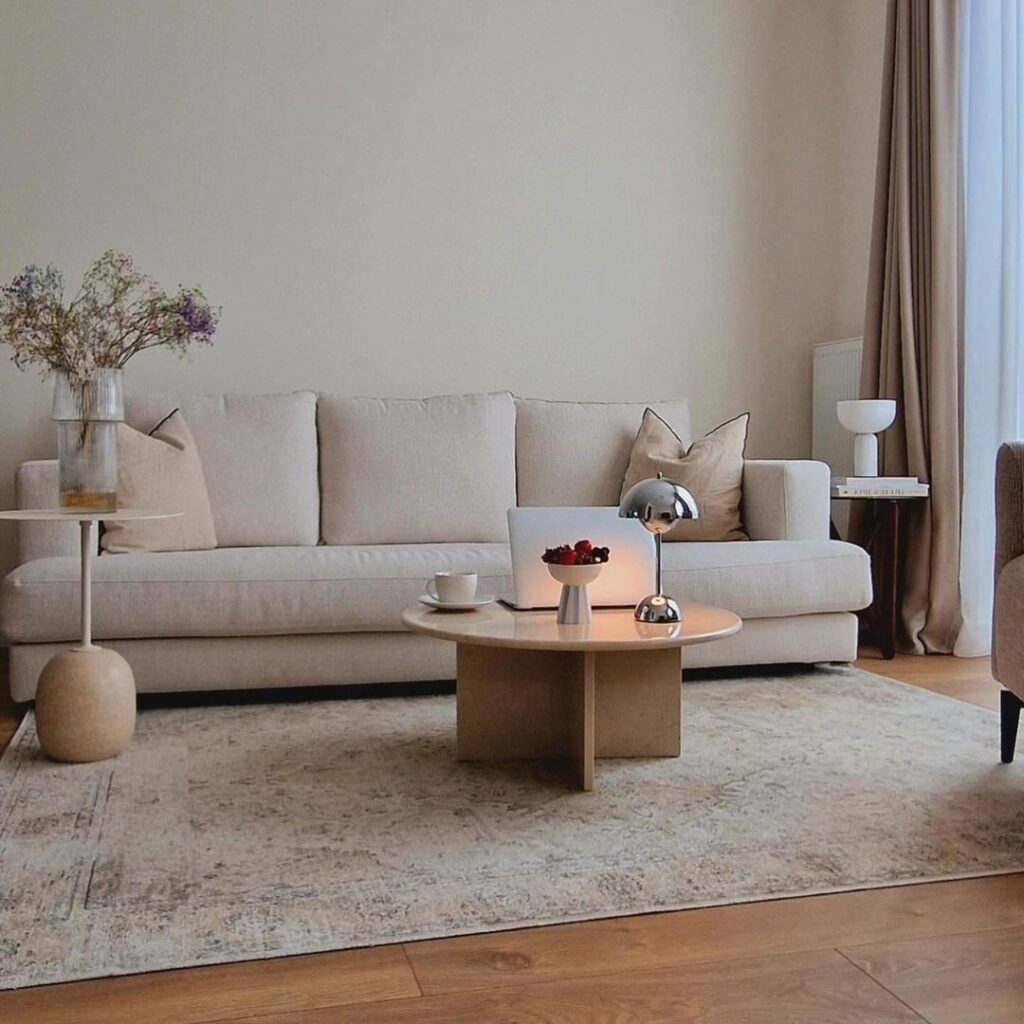 Minimalist beige living room with stylish decor