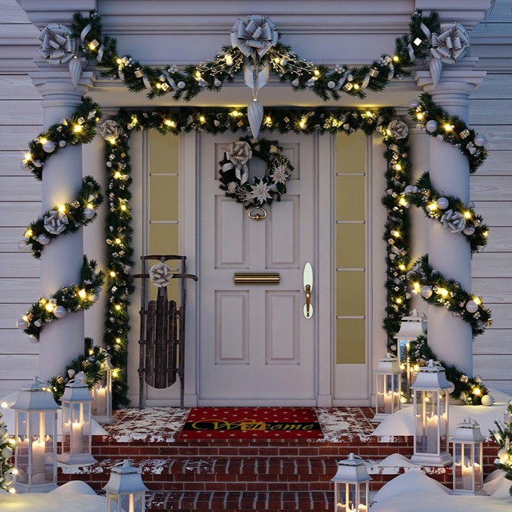 Elegant doorway with spiral lit garlands and lanterns