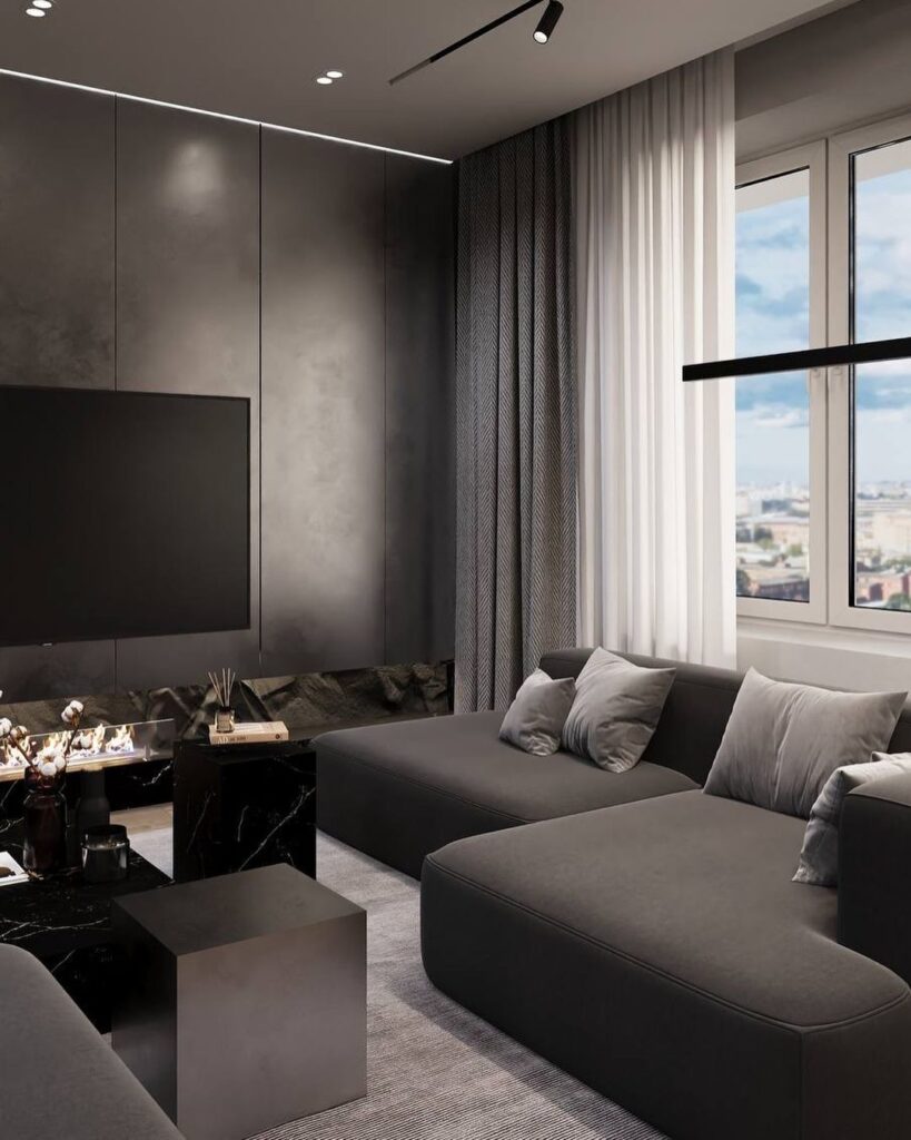 Modern grey living room with city view and sleek black accents.