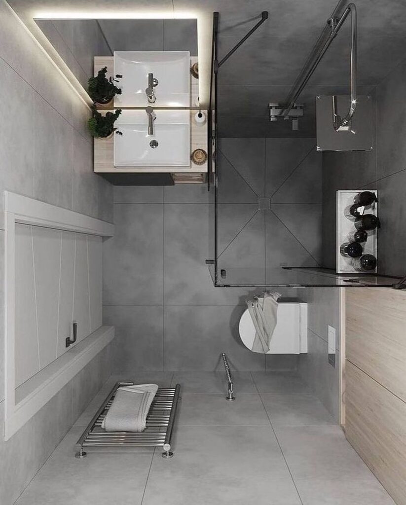 Minimalist gray bathroom with glass shower and floating sink