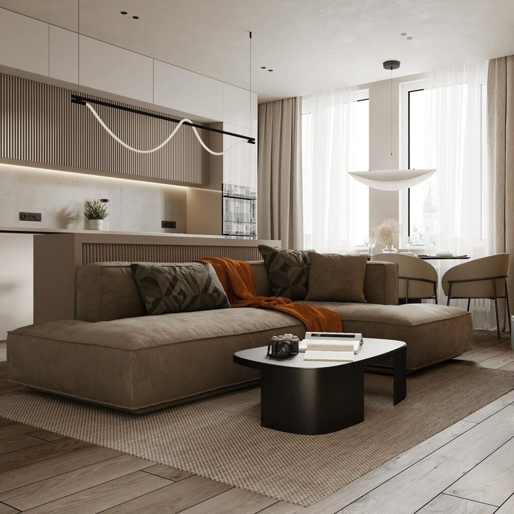 Modern living room with taupe sofa and wavy light fixture