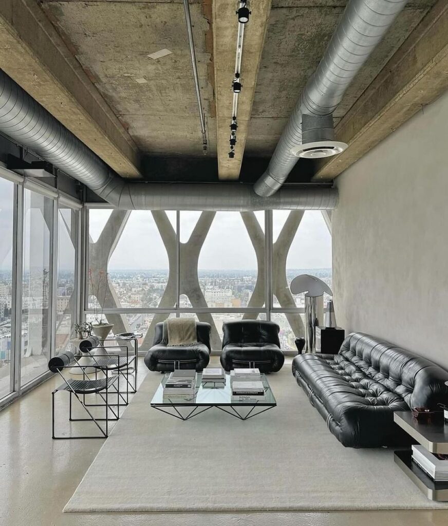 Industrial-style living room with panoramic city view window