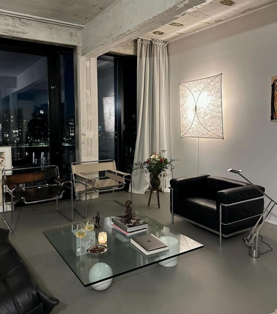 Modern living room with city view at night