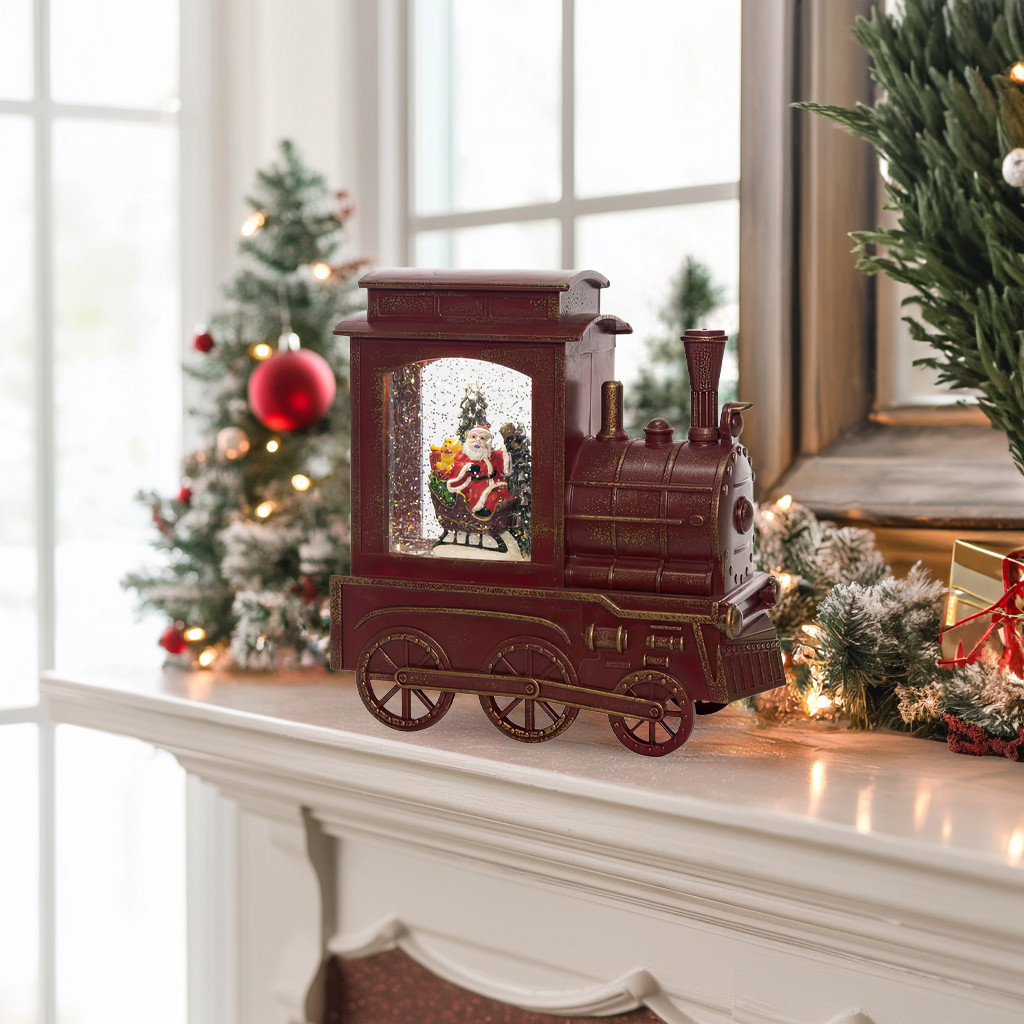 Antique-style Christmas train snow globe display with Santa scene