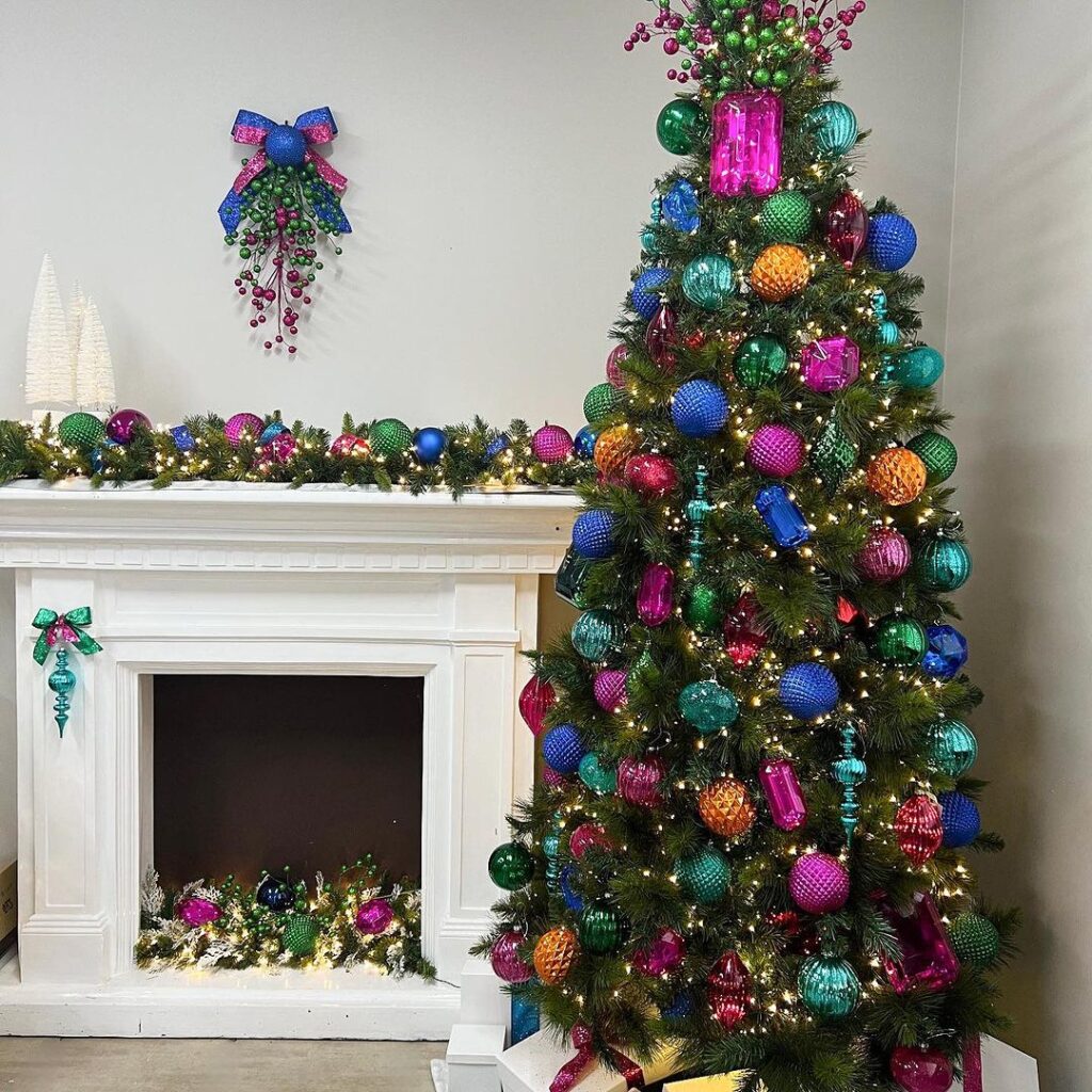 Christmas tree with multicolored ornaments beside decorated fireplace