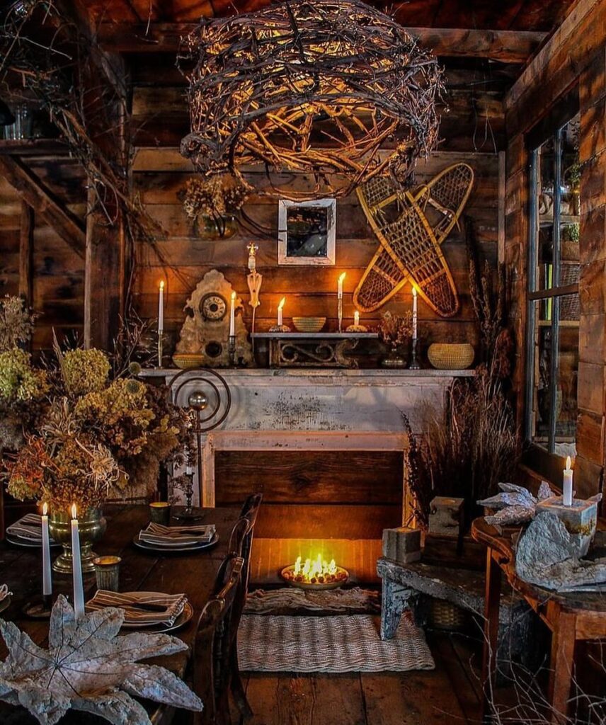 Rustic cabin interior with fireplace and witchy decor