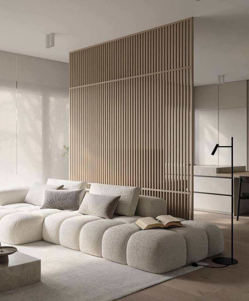 Minimalist living room with beige sofa and wooden divider