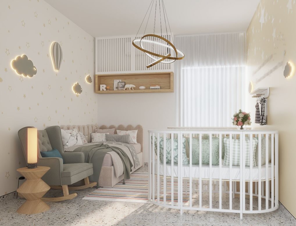 Modern nursery with cloud lights white crib and sage rocker