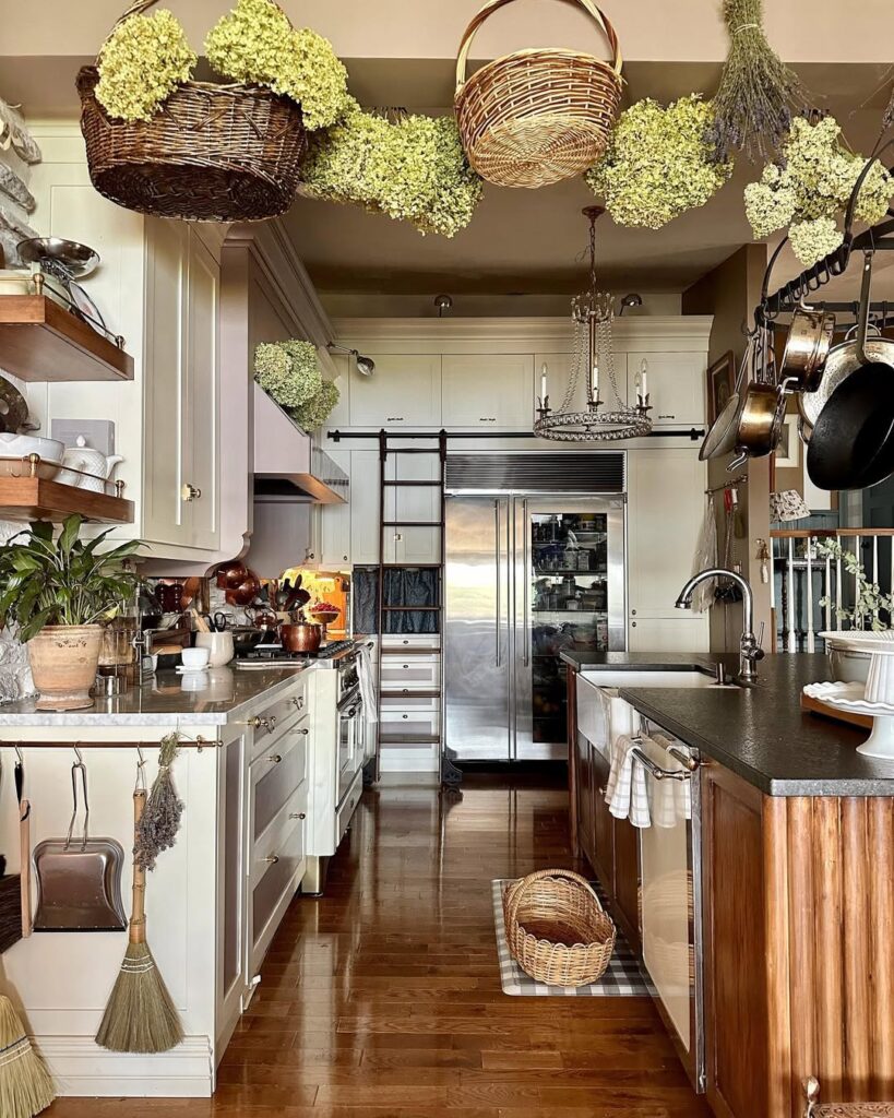 Rustic kitchen with hydrangeas, copper pots, wooden shelves