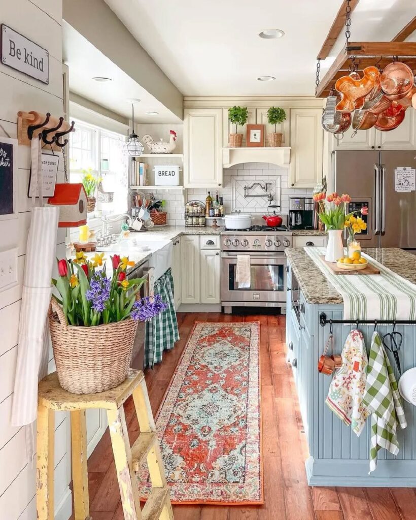 White cottage kitchen with floral displays and vintage runner rug