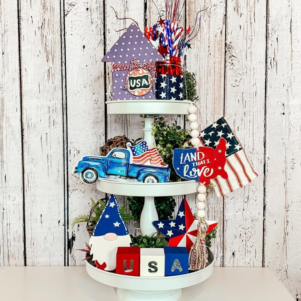 White tiered tray with patriotic decorations vintage truck and American flag accents