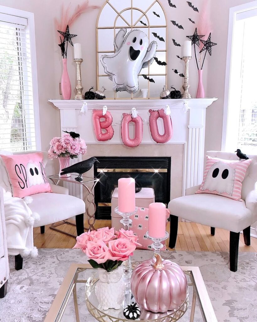 Pink and white Halloween themed living room with ghost decorations and metallic accents