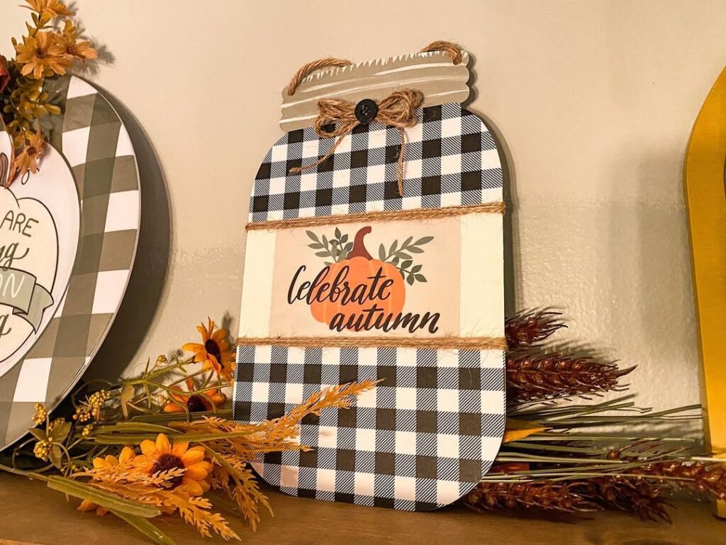 Mason jar shaped wall decor with buffalo check pattern and autumn florals