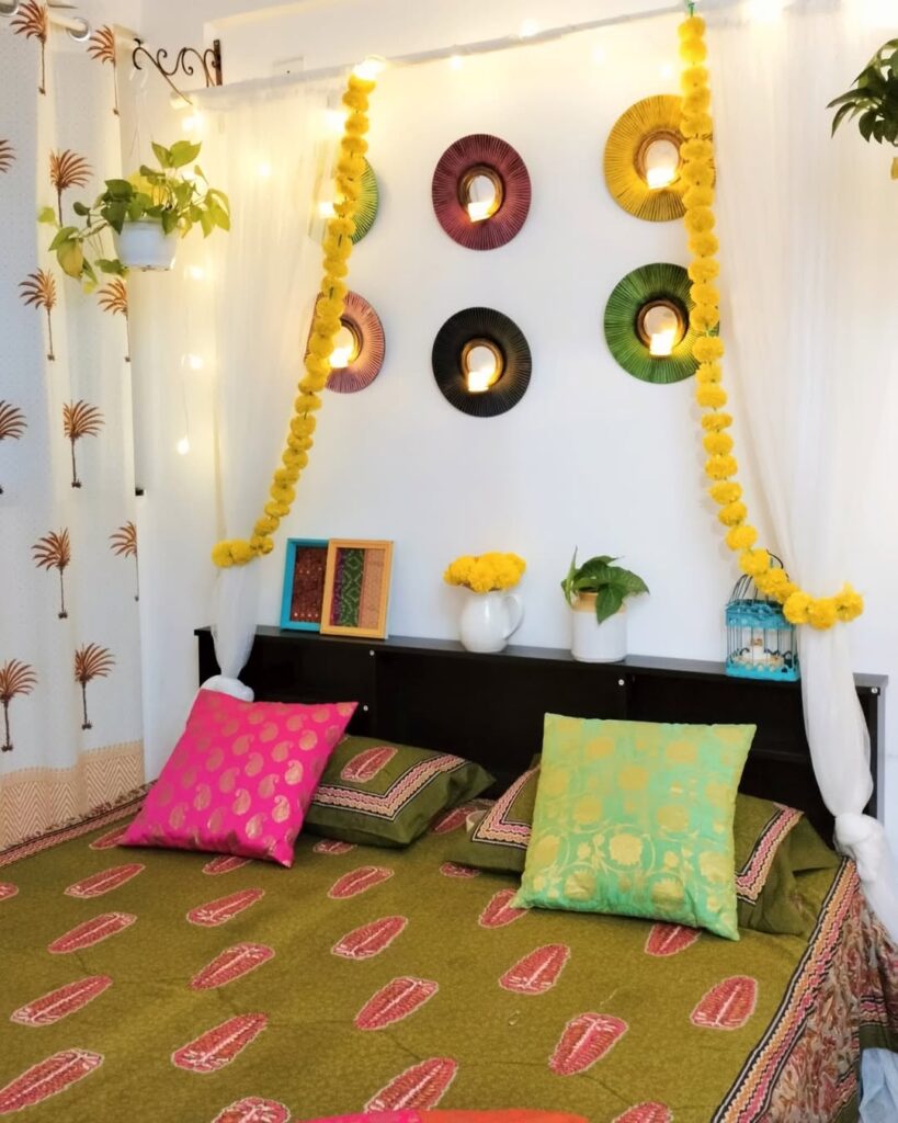  Indian inspired bedroom with marigold garlands colorful pillows and mirror decorations