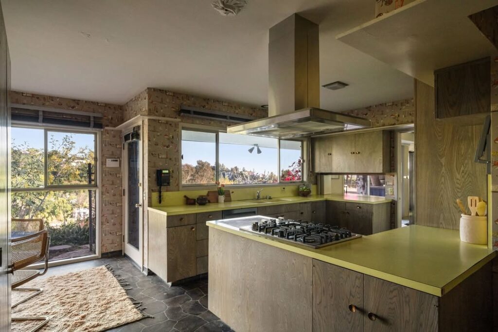 Kitchen with chartreuse counters and large windows