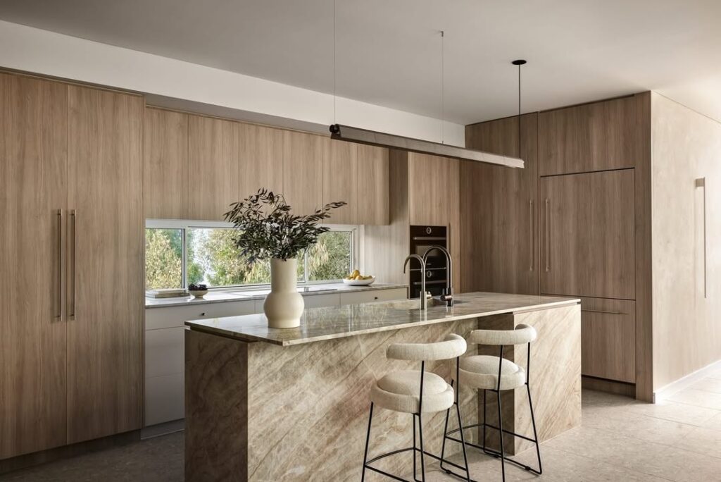  Minimalist kitchen with wood walls marble island modern stools