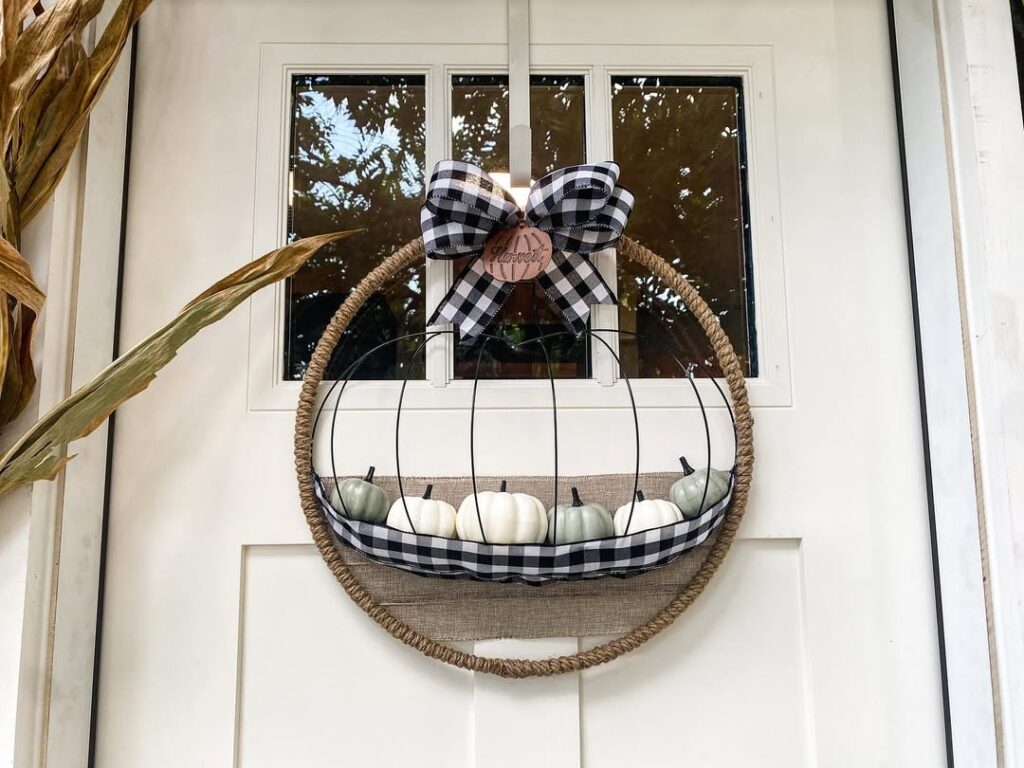 Round rope wreath with white pumpkins and buffalo check accents